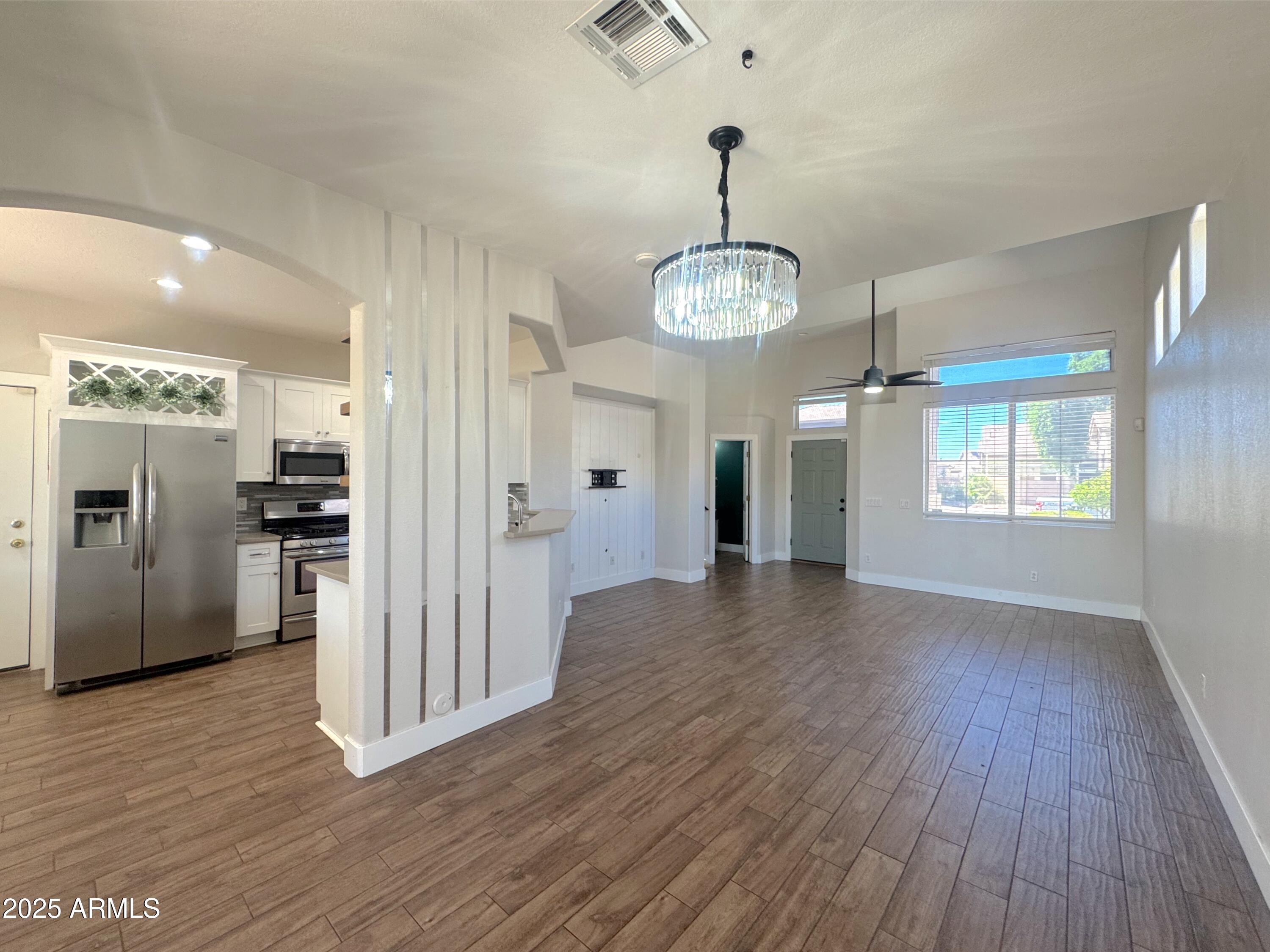 9331 East Lompoc Avenue Mesa, AZ 85209 - Photo 3 of 15 a view of a kitchen with refrigerator and wooden floor