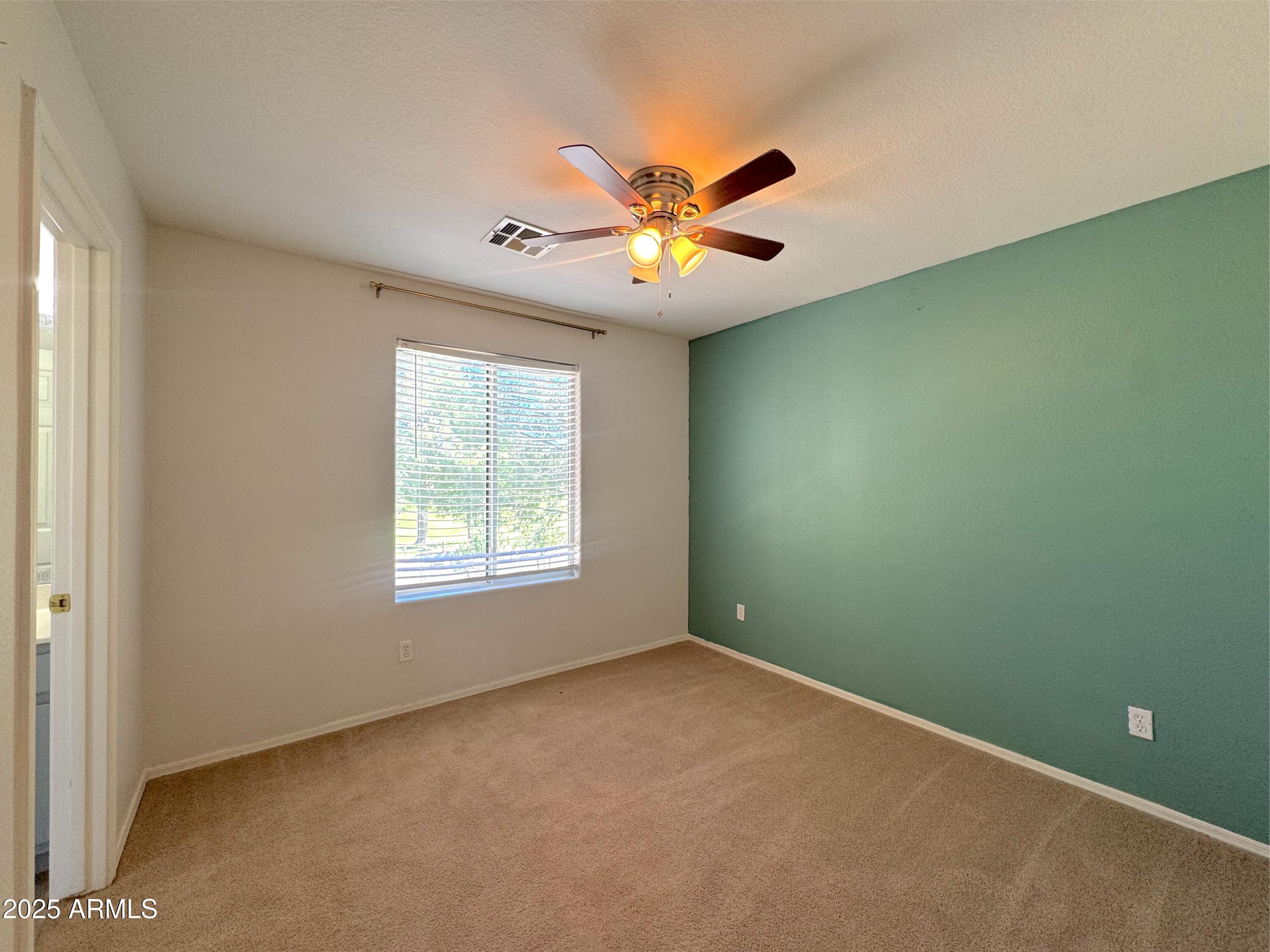 9331 East Lompoc Avenue Mesa, AZ 85209 - Photo 7 of 15 a view of an empty room with a window