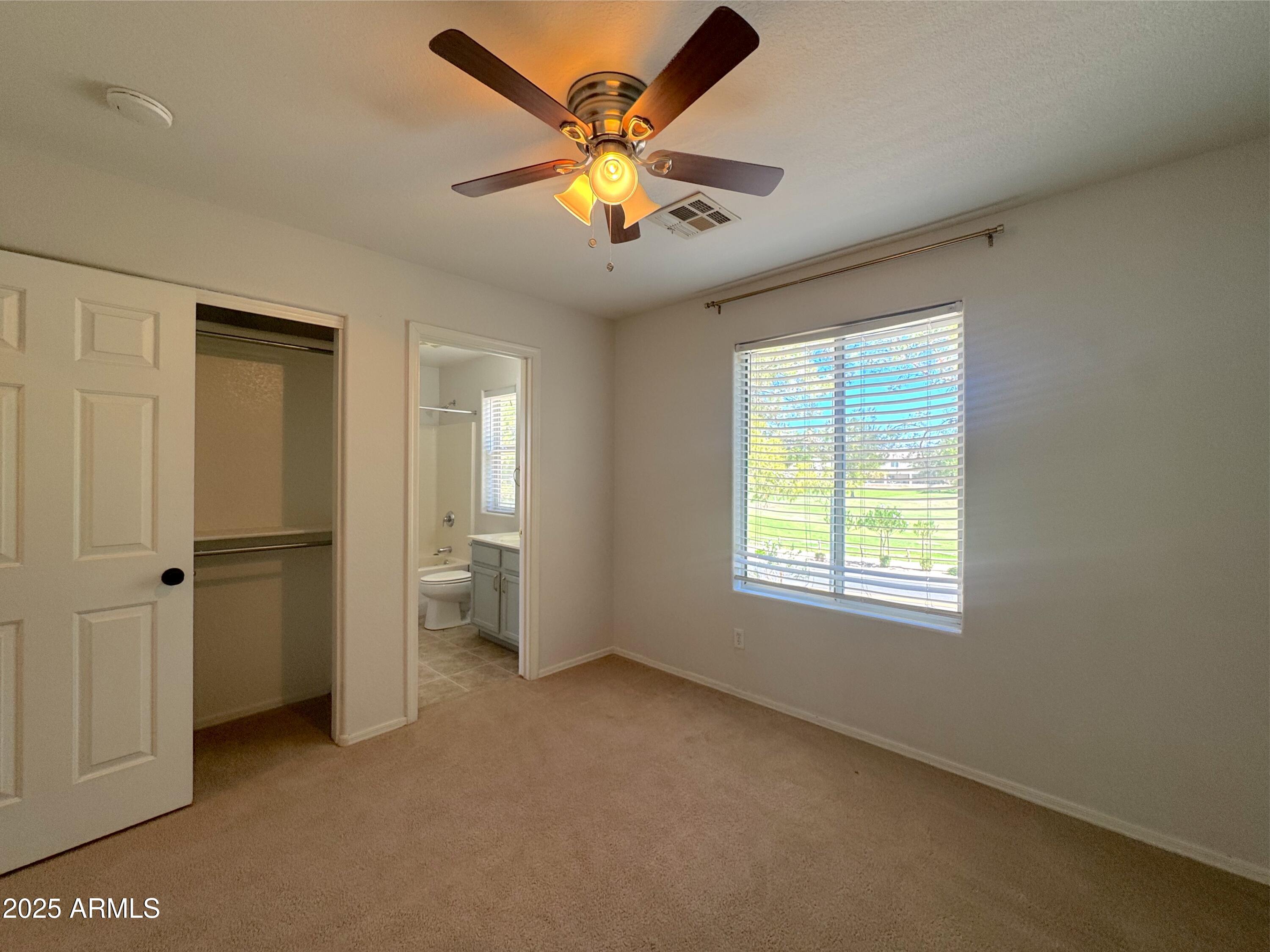 9331 East Lompoc Avenue Mesa, AZ 85209 - Photo 8 of 15 a view of an empty room with a window