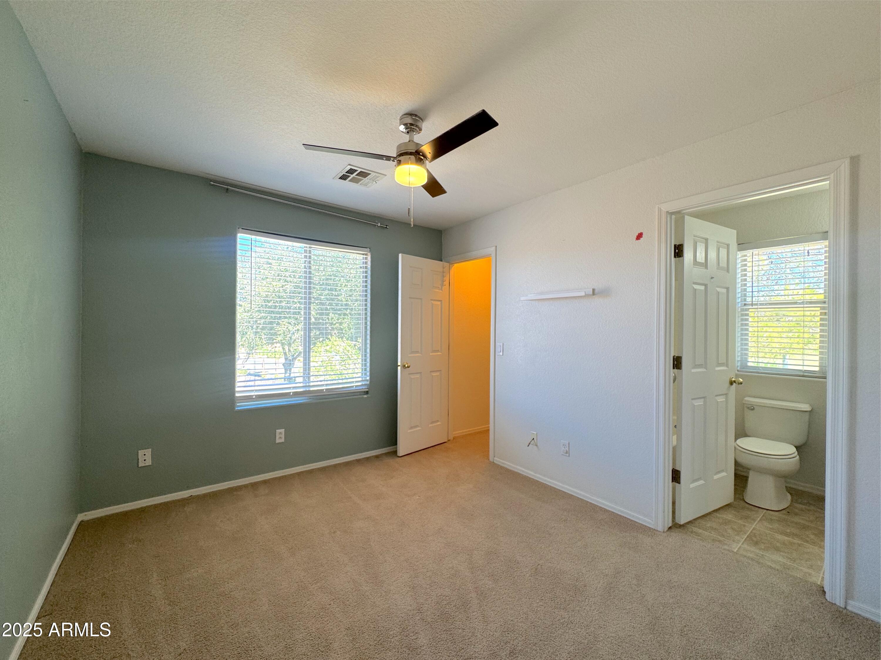 9331 East Lompoc Avenue Mesa, AZ 85209 - Photo 9 of 15 a view of an empty room with a window