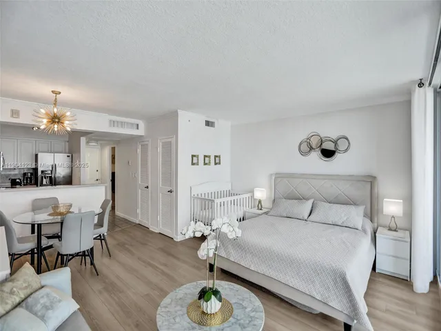 a bedroom with a bed and a table