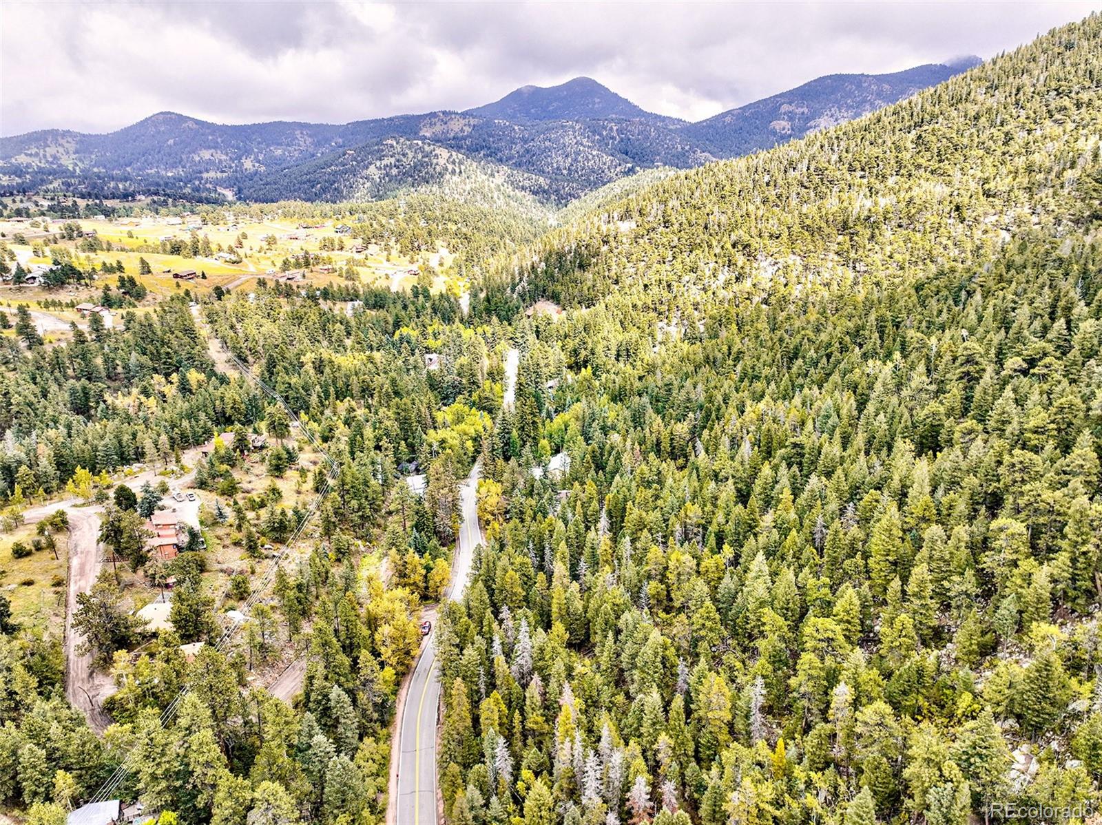 10862-10872 Twin Spruce Road Golden, CO 80403 - Photo 12 of 15 a view of a mountain with an outdoor space