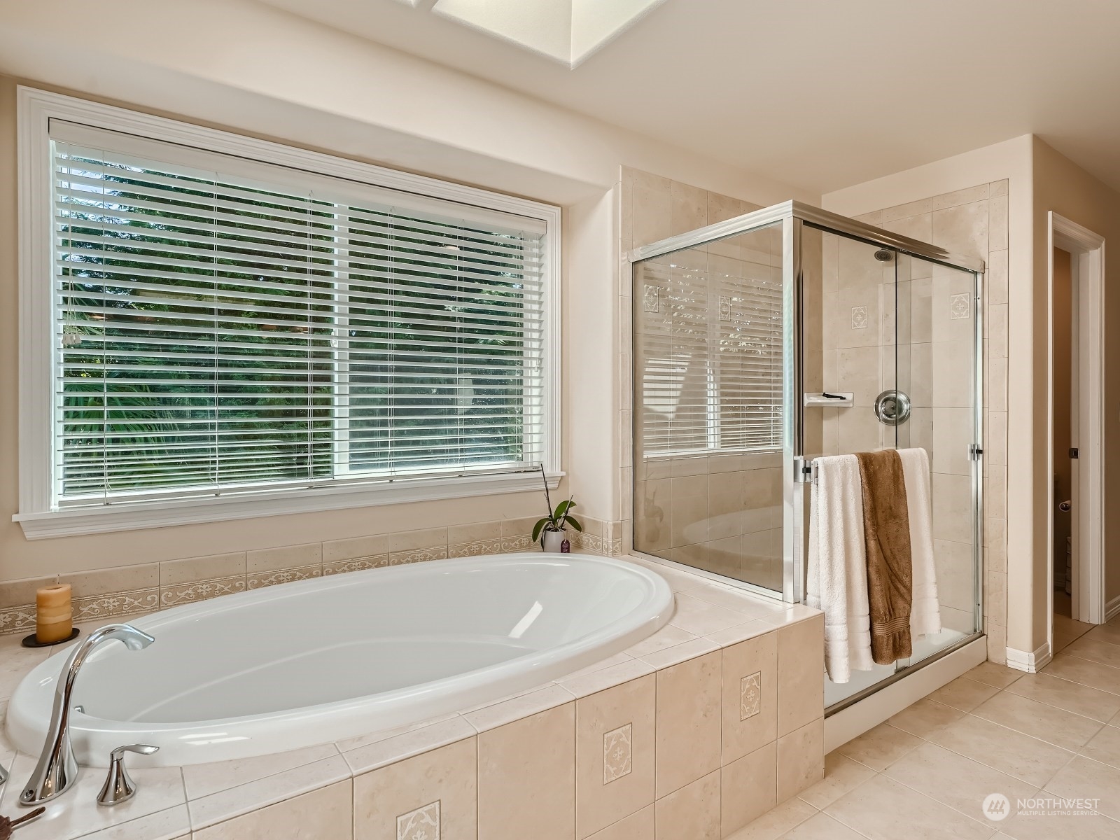 5215 Northeast 3rd Place Renton, WA 98059 - Photo 14 of 23 a bathroom with a bathtub and a shower