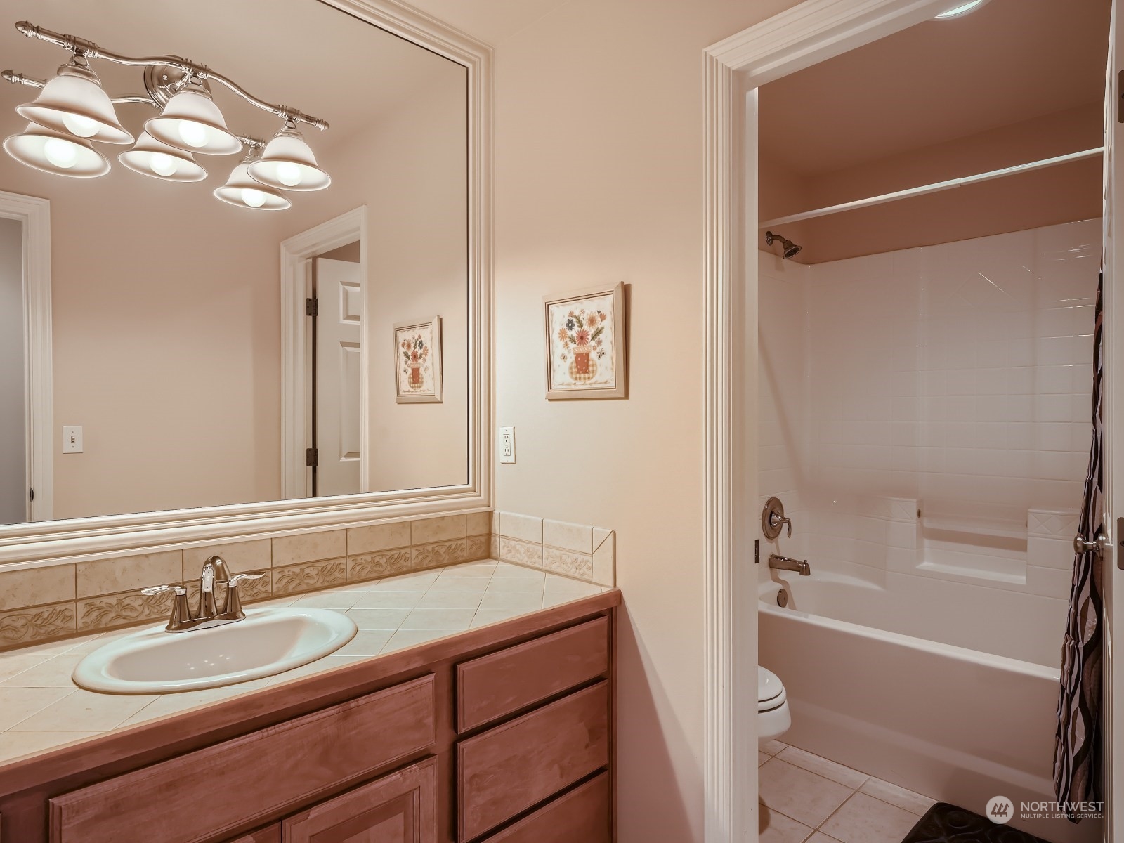 5215 Northeast 3rd Place Renton, WA 98059 - Photo 17 of 23 a bathroom with a granite countertop sink toilet and shower