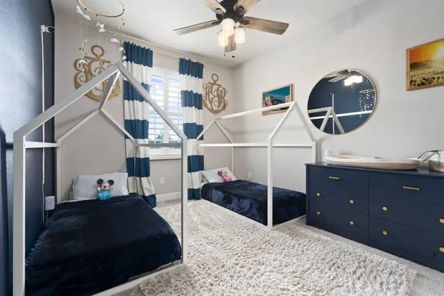 a living room with furniture and a mirror