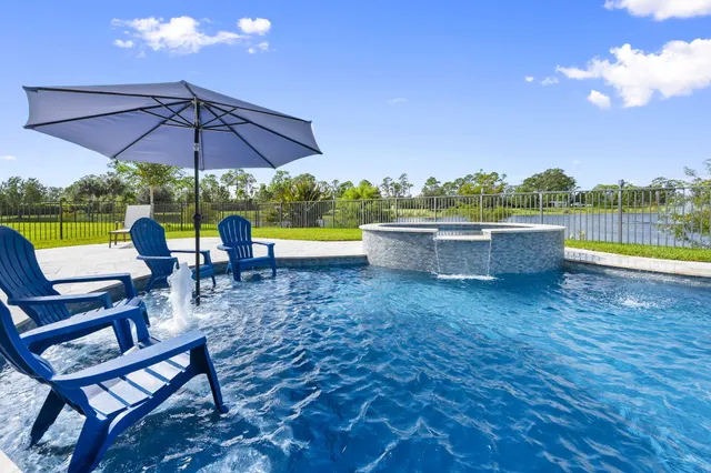 a view of a swimming pool with a patio