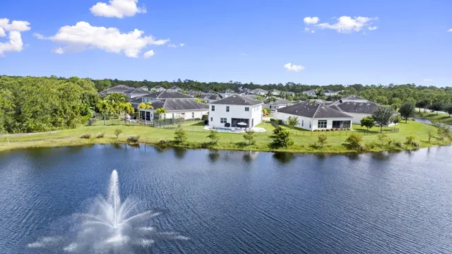 an aerial view of a house with a swimming pool