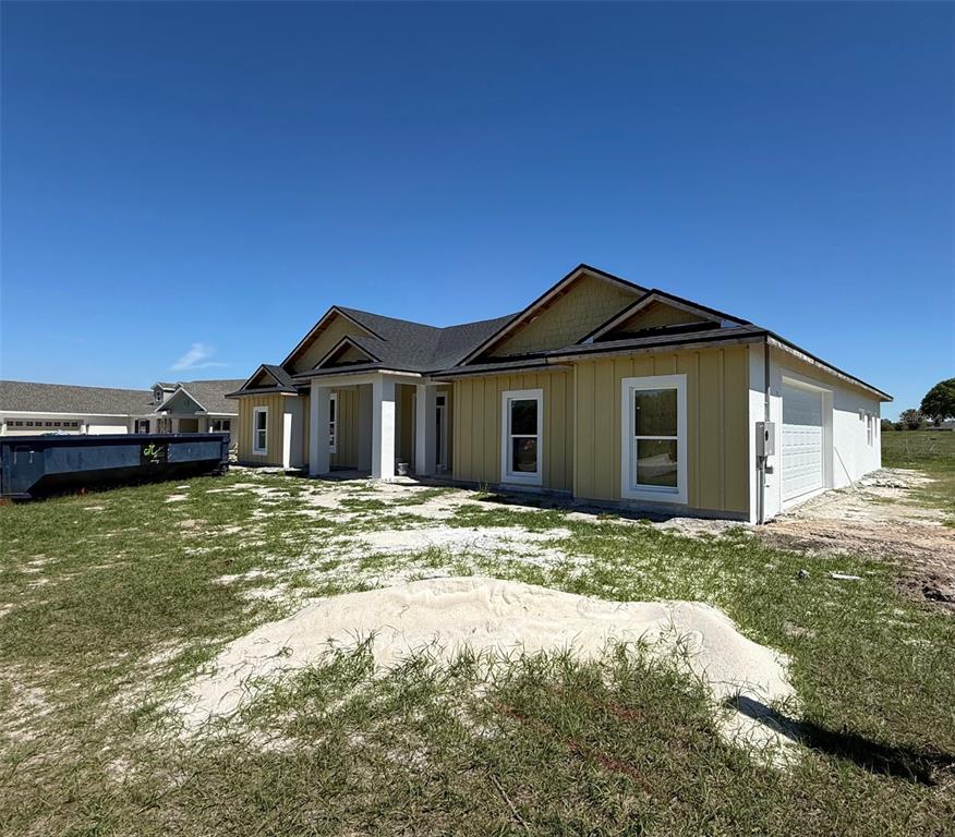 2066 Northwest 79th Loop Ocala, FL 34475 - Photo 1 of 15 a view of a house with a yard