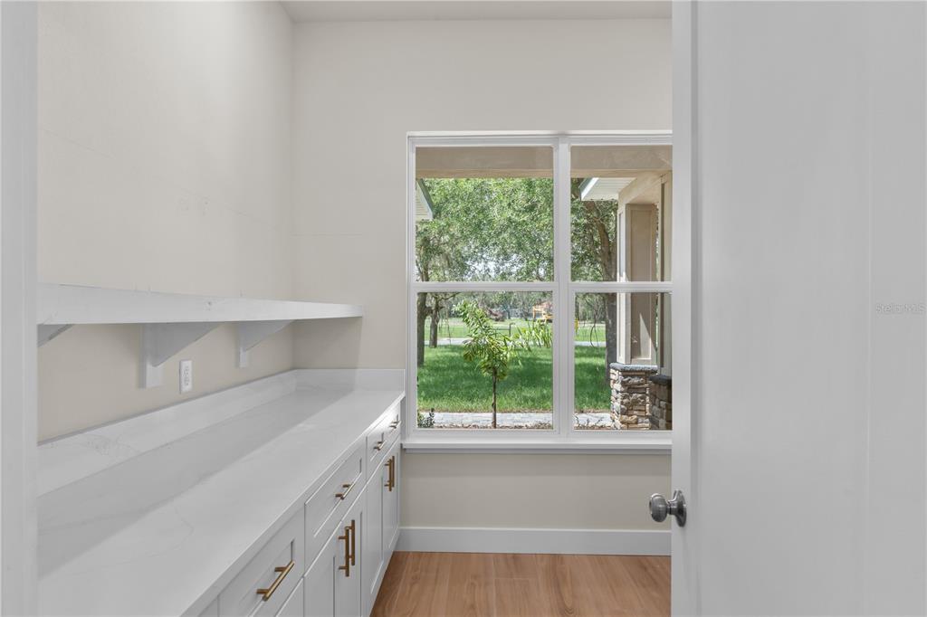 2066 Northwest 79th Loop Ocala, FL 34475 - Photo 5 of 15 a kitchen with a sink and large window