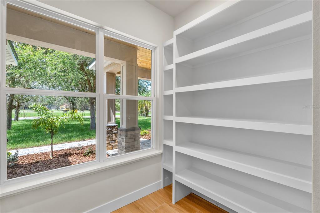 2066 Northwest 79th Loop Ocala, FL 34475 - Photo 6 of 15 a view of walk in closet with empty racks