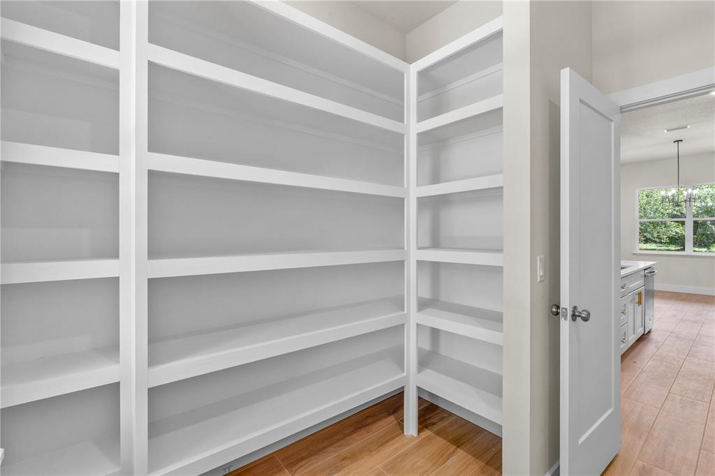 2066 Northwest 79th Loop Ocala, FL 34475 - Photo 7 of 15 a view of walk in closet with empty racks