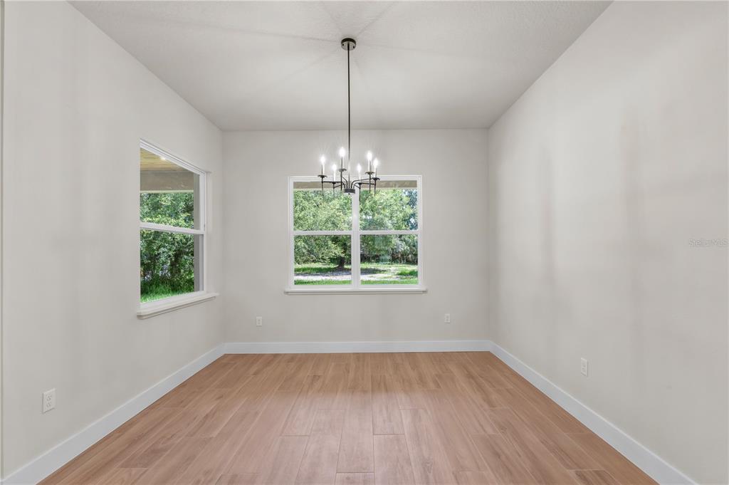 2066 Northwest 79th Loop Ocala, FL 34475 - Photo 9 of 15 a view of a room window wooden floor and front door