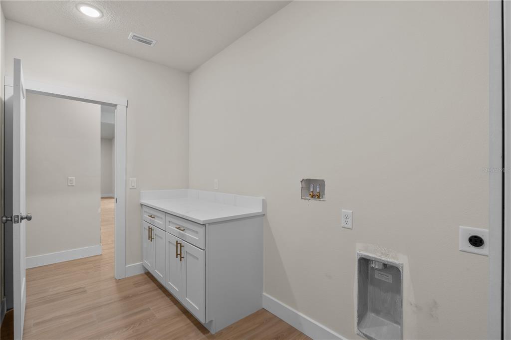 2066 Northwest 79th Loop Ocala, FL 34475 - Photo 10 of 15 a kitchen with a stove and a refrigerator