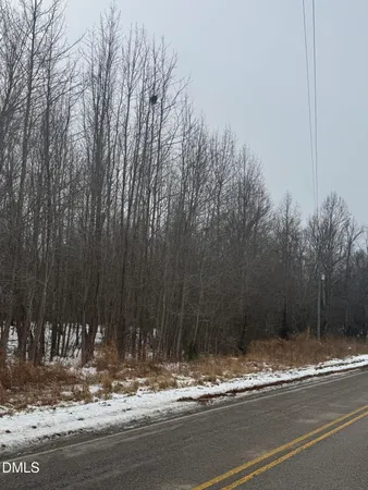 a view of a house with trees in the background