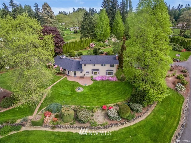 7621 Skipley Road Snohomish, WA 98290 - Photo 1 of 25 a view of a house with a big yard and potted plants