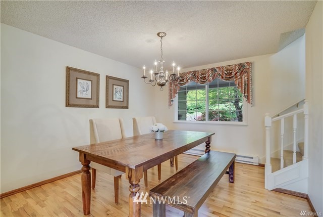 7621 Skipley Road Snohomish, WA 98290 - Photo 12 of 25 a view of a dining room with furniture and chandelier