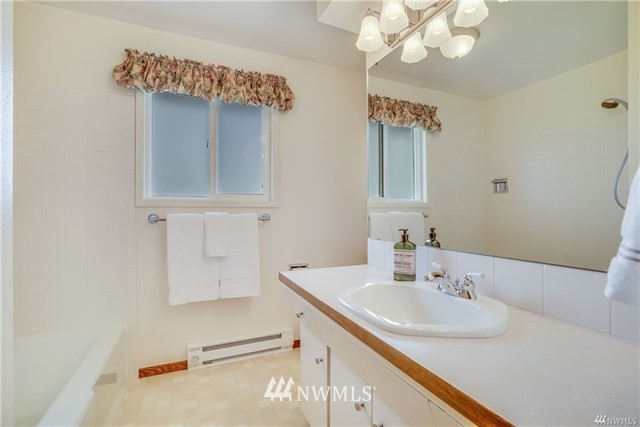 7621 Skipley Road Snohomish, WA 98290 - Photo 15 of 25 a bathroom with a sink and a mirror