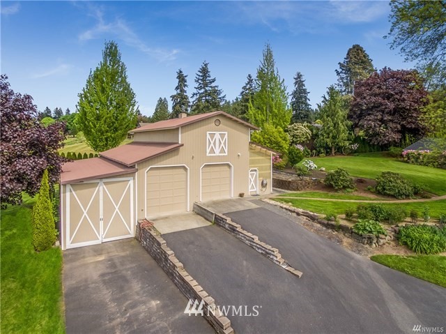7621 Skipley Road Snohomish, WA 98290 - Photo 19 of 25 a front view of a house with a yard and garage