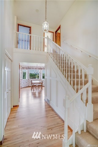7621 Skipley Road Snohomish, WA 98290 - Photo 6 of 25 a view of entryway and hall with wooden floor