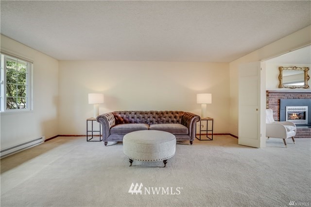7621 Skipley Road Snohomish, WA 98290 - Photo 7 of 25 a living room with furniture and a lamp