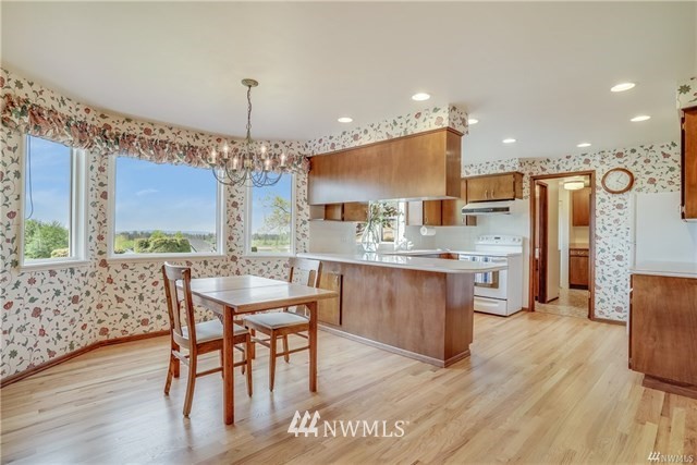 7621 Skipley Road Snohomish, WA 98290 - Photo 10 of 25 a large kitchen with a table and chairs