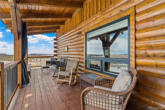 a view of a chairs and tables in the balcony