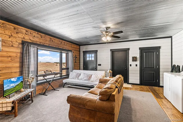 a bedroom with furniture and wooden floor