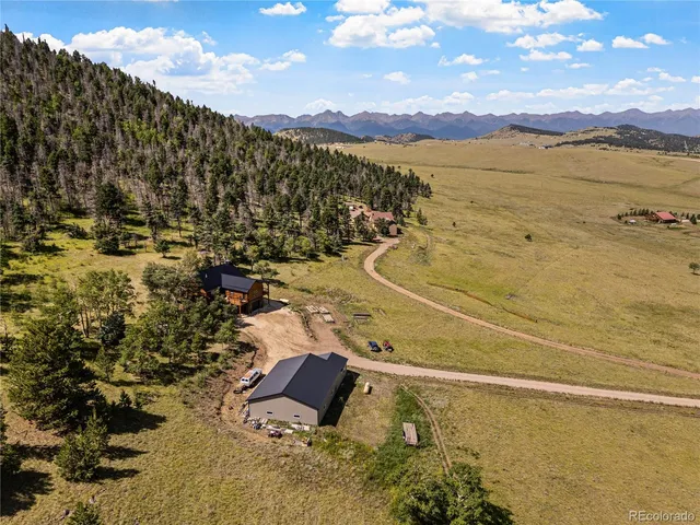 a view of an ocean and a mountain