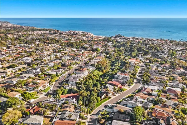 an aerial view of residential building and ocean
