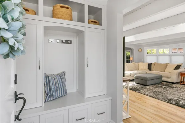 a living room with furniture flowerpot and a window