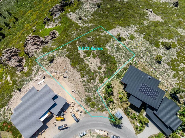 an aerial view of house with yard