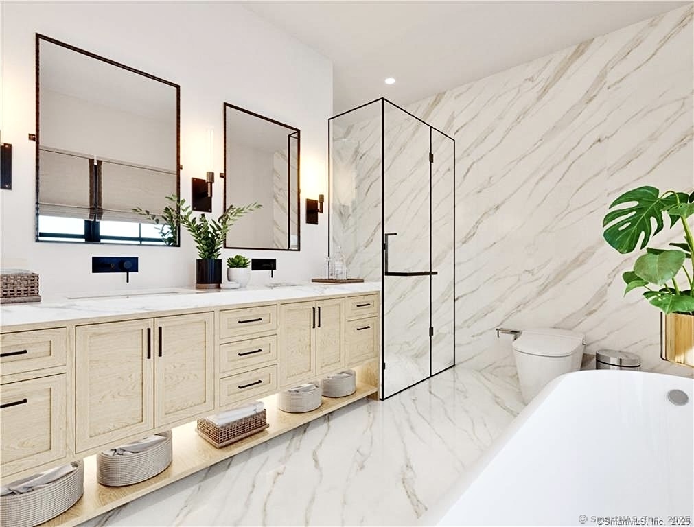 1008 Fairfield Beach Road Fairfield, CT 06824 - Photo 17 of 27 a spacious bathroom with double vanity sink a mirror a bathtub and shower