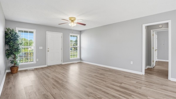 19 Ash Grove Road Fayetteville, TN 37334 - Photo 11 of 31 a view of an empty room with wooden floor and a window