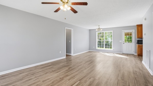 19 Ash Grove Road Fayetteville, TN 37334 - Photo 13 of 31 wooden floor in an empty room with a window