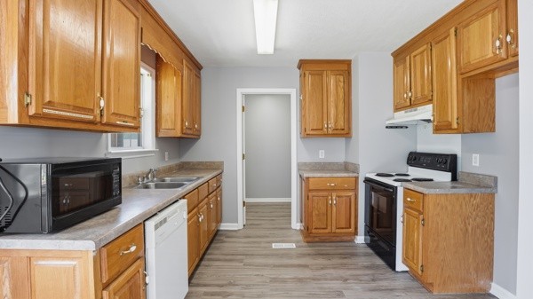 19 Ash Grove Road Fayetteville, TN 37334 - Photo 17 of 31 a kitchen with a stove a sink and a refrigerator
