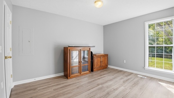 19 Ash Grove Road Fayetteville, TN 37334 - Photo 23 of 31 an empty room with wooden floor and windows