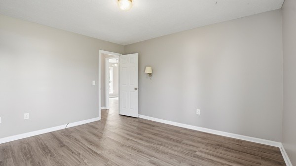19 Ash Grove Road Fayetteville, TN 37334 - Photo 24 of 31 a view of an empty room with wooden floor and a window