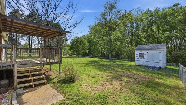 19 Ash Grove Road Fayetteville, TN 37334 - Photo 6 of 31 a backyard of a house with barbeque oven table and chairs