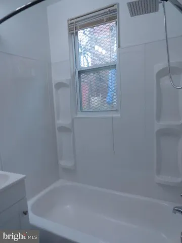 a close up of a bathtub in a bathroom