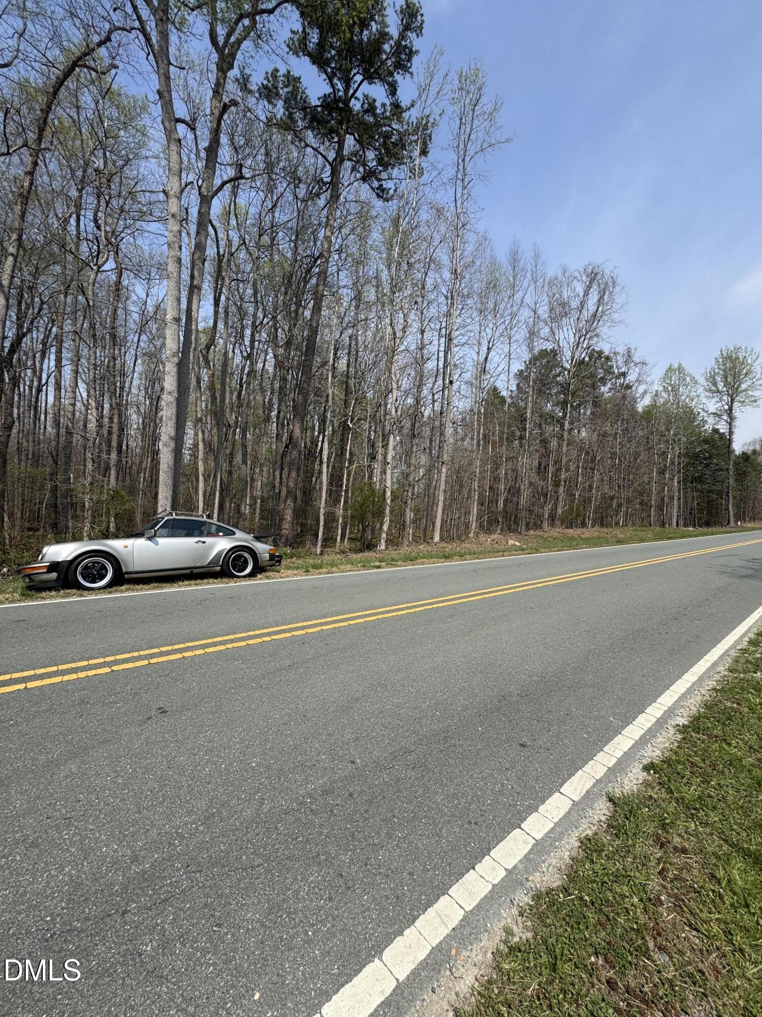 0 Hurdle Mills Road Hurdle Mills, NC 27541 - Photo 3 of 7 a car parked on the side of the road