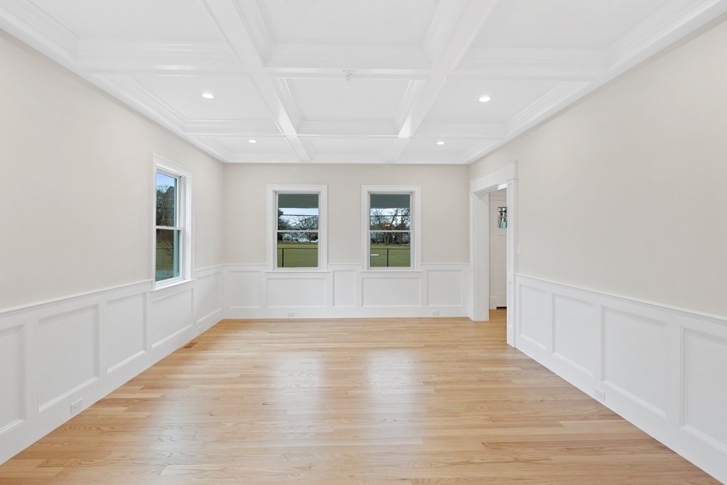 28 Hillside Avenue Needham, MA 02494 - Photo 11 of 32 a view of an empty room with wooden floor and a window