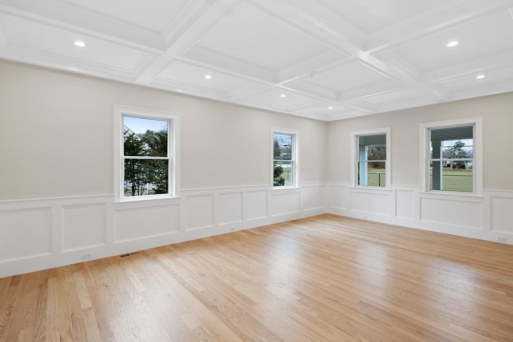 28 Hillside Avenue Needham, MA 02494 - Photo 12 of 32 a view of an empty room with wooden floor and a window