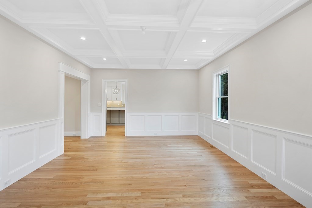 28 Hillside Avenue Needham, MA 02494 - Photo 13 of 32 a view of an empty room with wooden floor and a window
