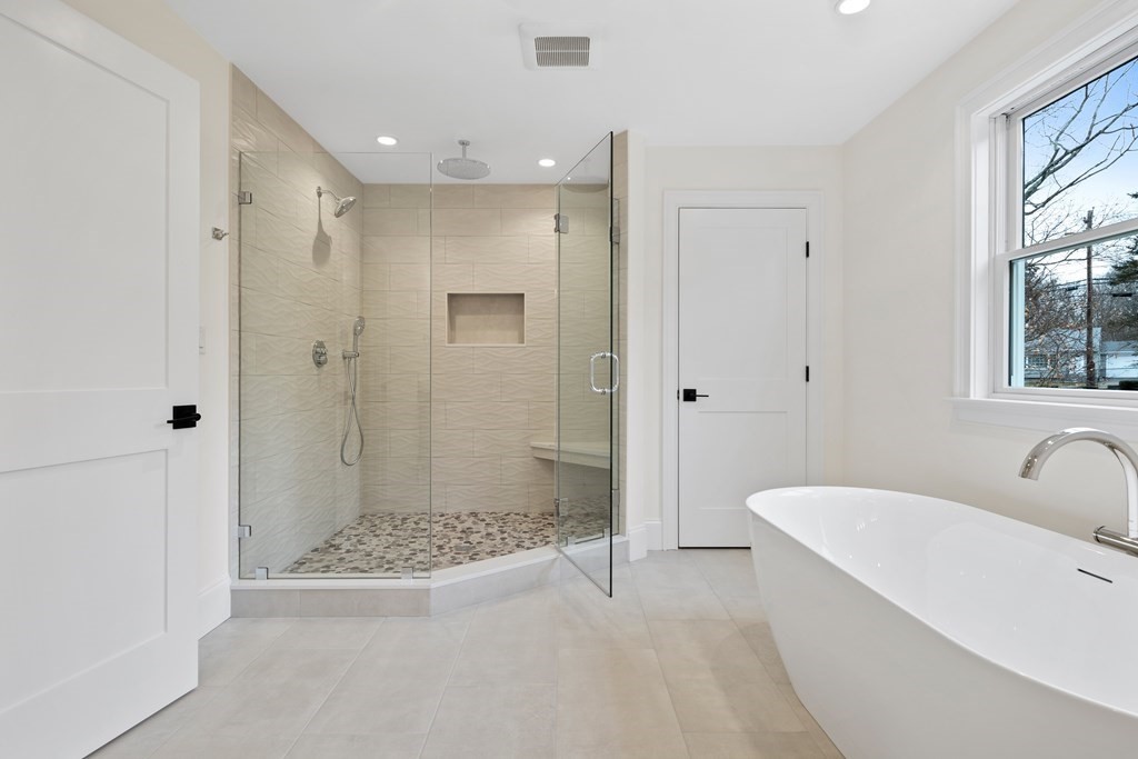 28 Hillside Avenue Needham, MA 02494 - Photo 15 of 32 a bathroom with a tub shower and sink