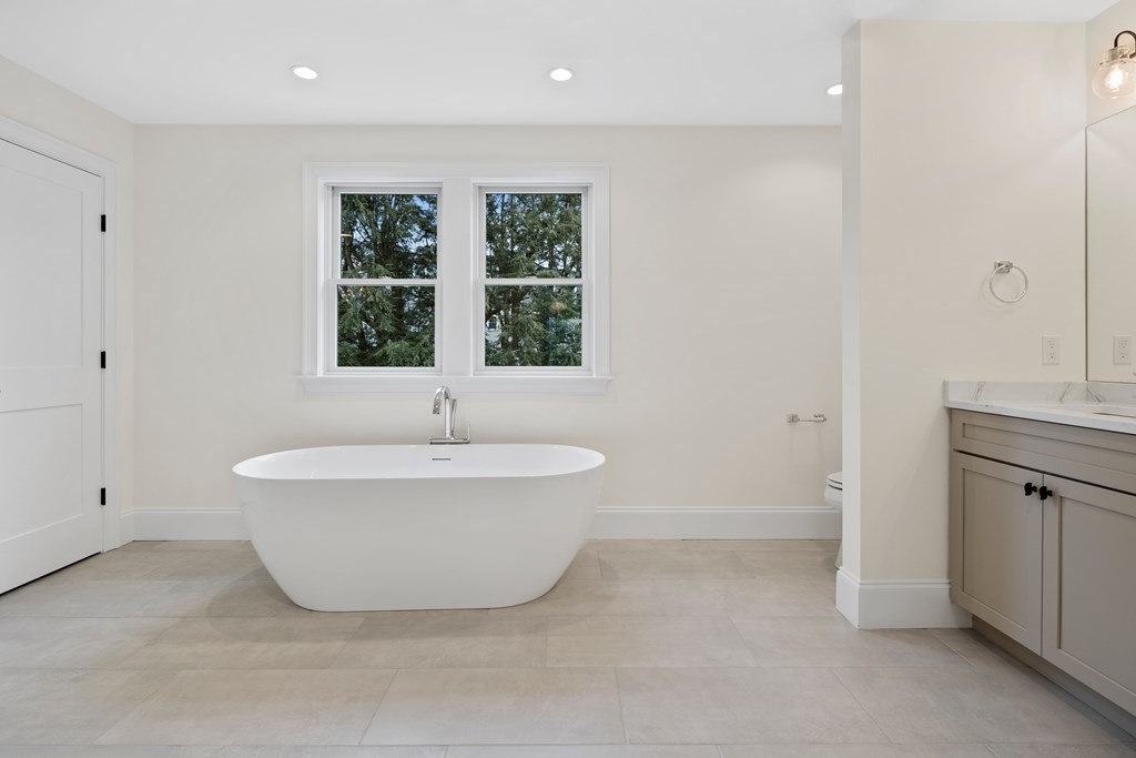 28 Hillside Avenue Needham, MA 02494 - Photo 17 of 32 a spacious bathroom with a bathtub and window