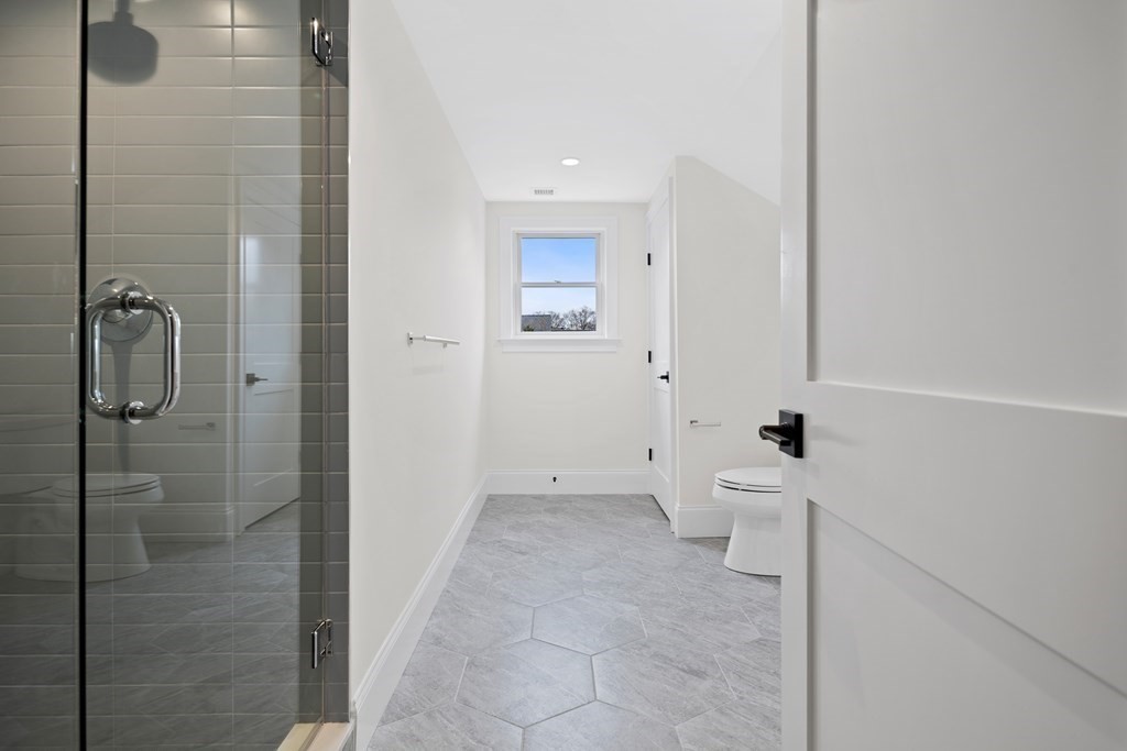 28 Hillside Avenue Needham, MA 02494 - Photo 20 of 32 a bathroom with a toilet sink and shower