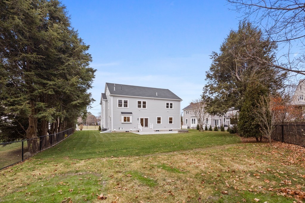 28 Hillside Avenue Needham, MA 02494 - Photo 2 of 32 a big house with yard in front of it