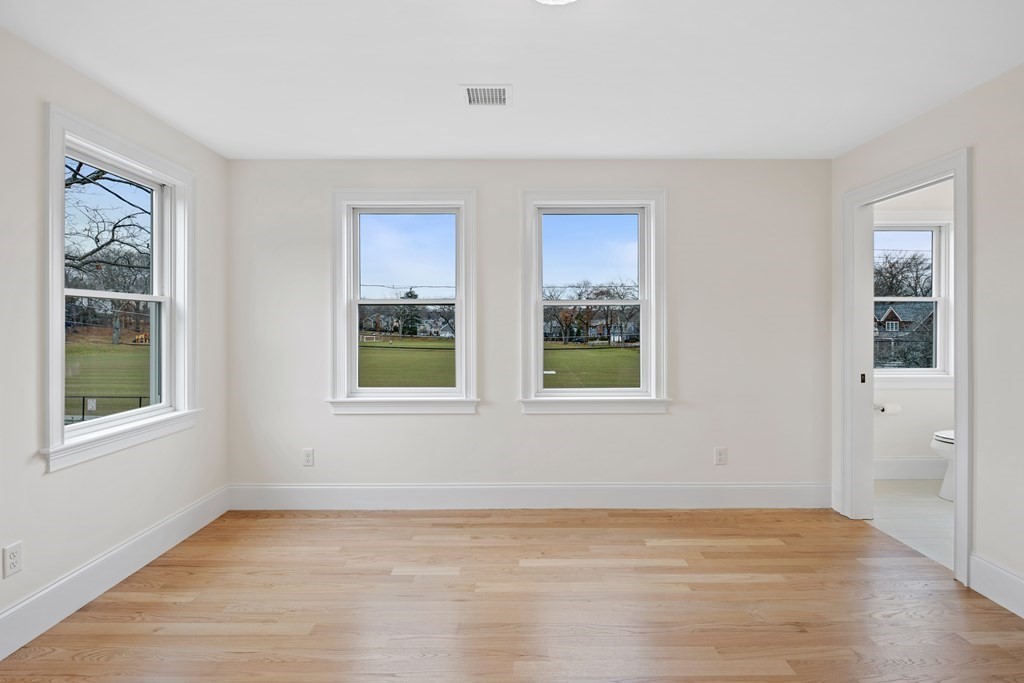 28 Hillside Avenue Needham, MA 02494 - Photo 27 of 32 a view of an empty room with window and hardwood floor