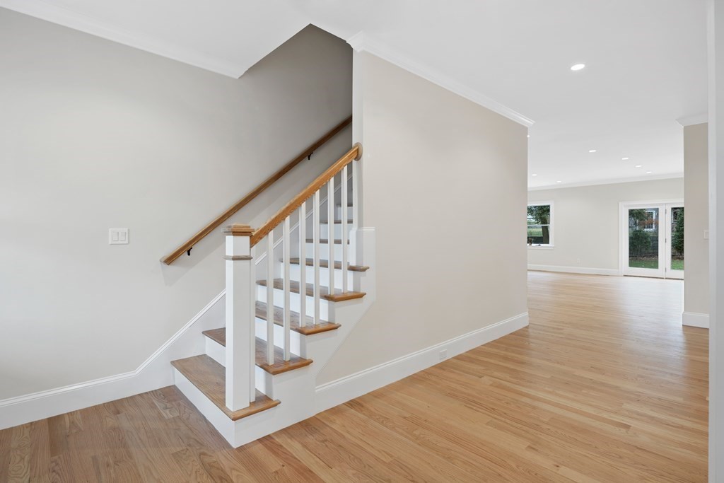 28 Hillside Avenue Needham, MA 02494 - Photo 30 of 32 a view of entryway with wooden floor and stairs