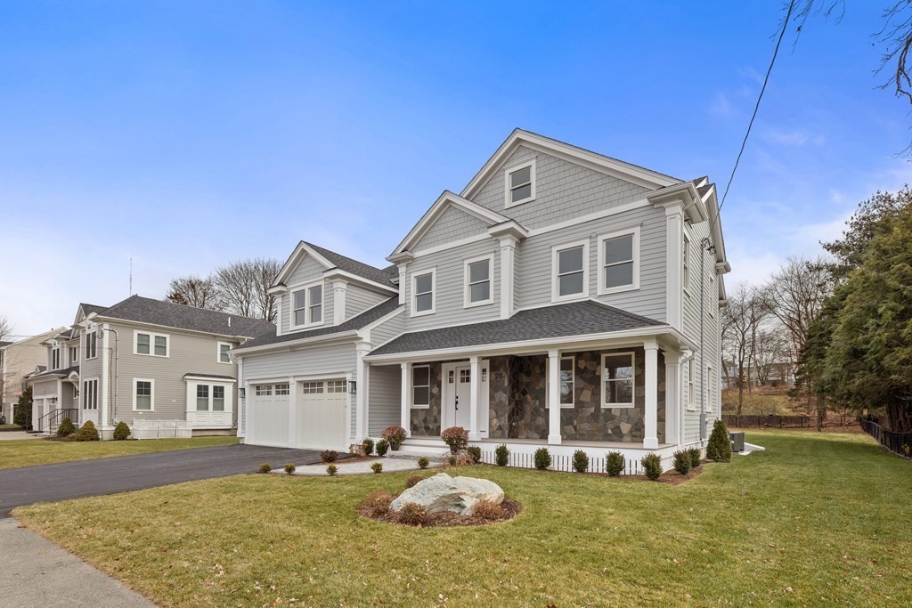 28 Hillside Avenue Needham, MA 02494 - Photo 3 of 32 a front view of a house with swimming pool